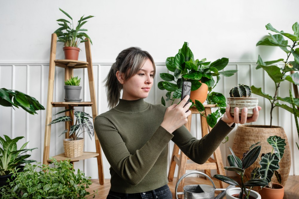 woman taking a selfie with plants 