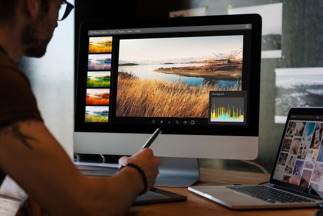 man editing on computer